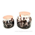 Swirled spots glass candle holder with metal lid